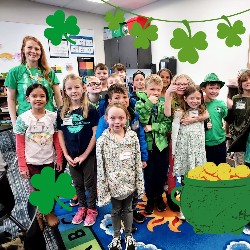 Students and teachers wearing green, decorated with shamrocks.